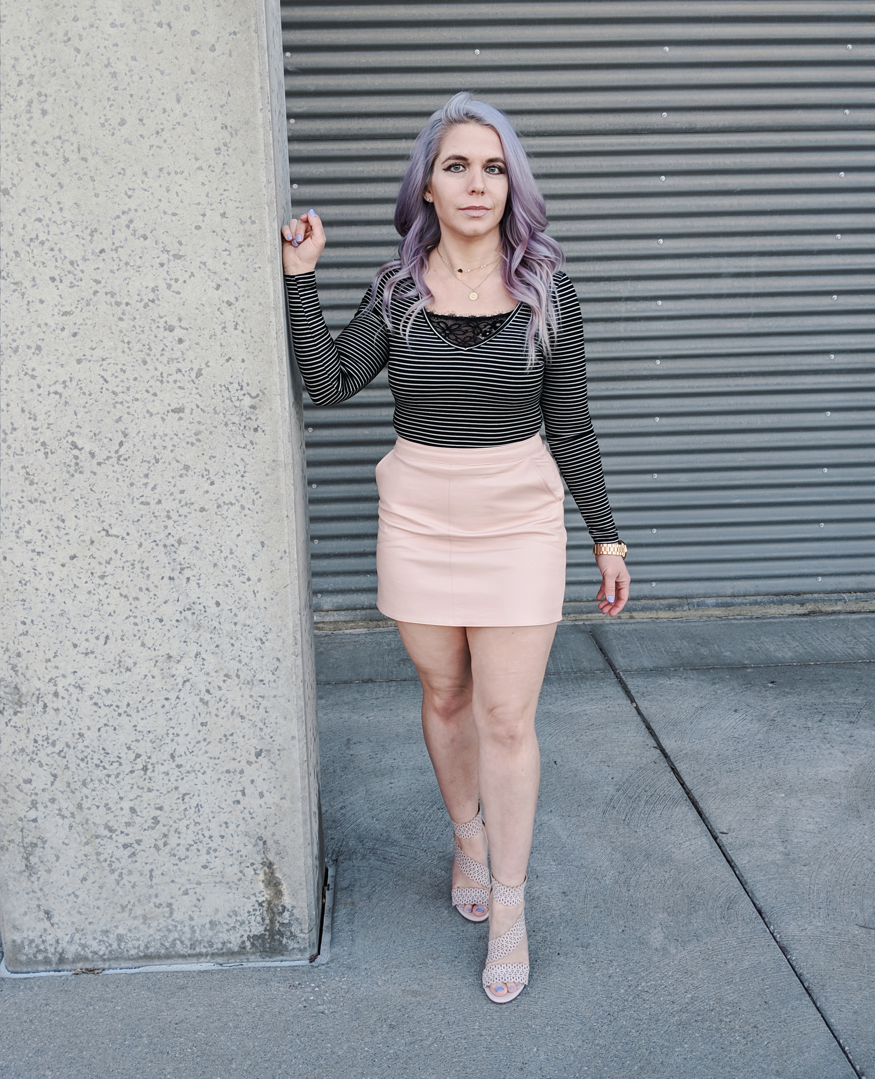 Cute Shoes for Spring 2019 - Where to find the best cute shoes for spring 2019! Kansas City fashion blogger Tricia Nibarger of COVET by tricia showcases the shoe selection at Off Broadway Shoes at Legends Outlets in Kansas City. (ad) Strappy nude sandals are paired with a pink leather mini skirt, black bodysuit, and cute bralette. #obshoes #fashion #style #fashionista #styleinspo