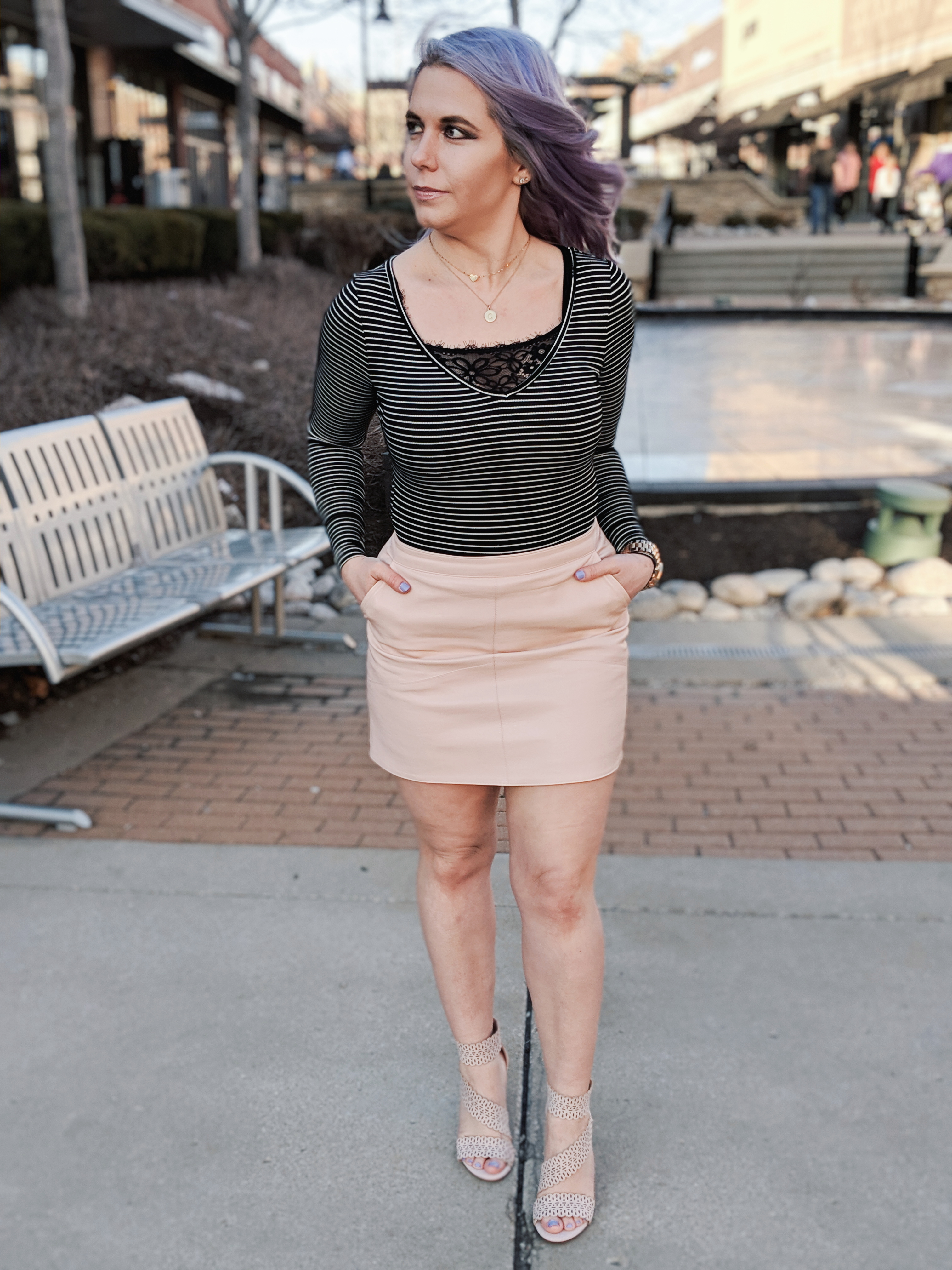 Cute Shoes for Spring 2019 - Where to find the best cute shoes for spring 2019! Kansas City fashion blogger Tricia Nibarger of COVET by tricia showcases the shoe selection at Off Broadway Shoes at Legends Outlets in Kansas City. (ad) Strappy nude sandals are paired with a pink leather mini skirt, black bodysuit, and cute bralette. #obshoes #fashion #style #fashionista #styleinspo
