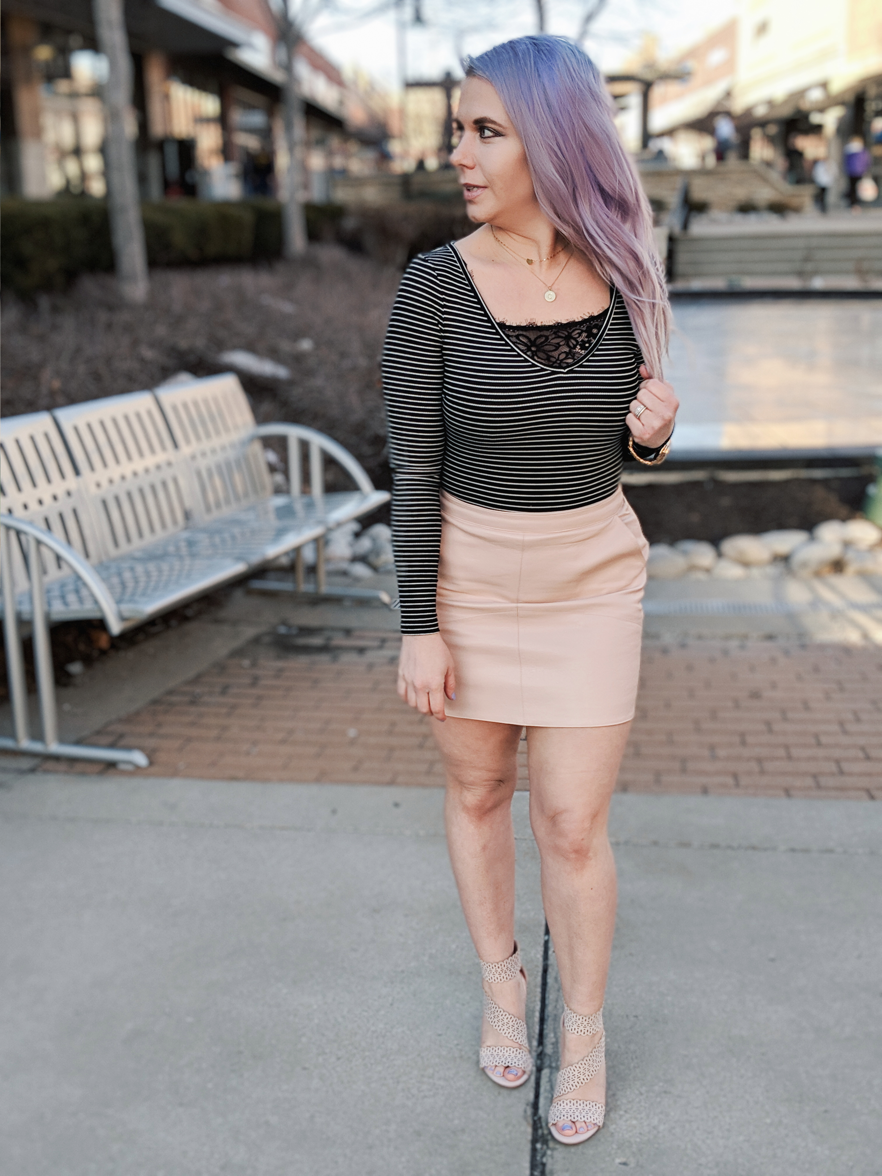 Cute Shoes for Spring 2019 - Where to find the best cute shoes for spring 2019! Kansas City fashion blogger Tricia Nibarger of COVET by tricia showcases the shoe selection at Off Broadway Shoes at Legends Outlets in Kansas City. (ad) Strappy nude sandals are paired with a pink leather mini skirt, black bodysuit, and cute bralette. #obshoes #fashion #style #fashionista #styleinspo