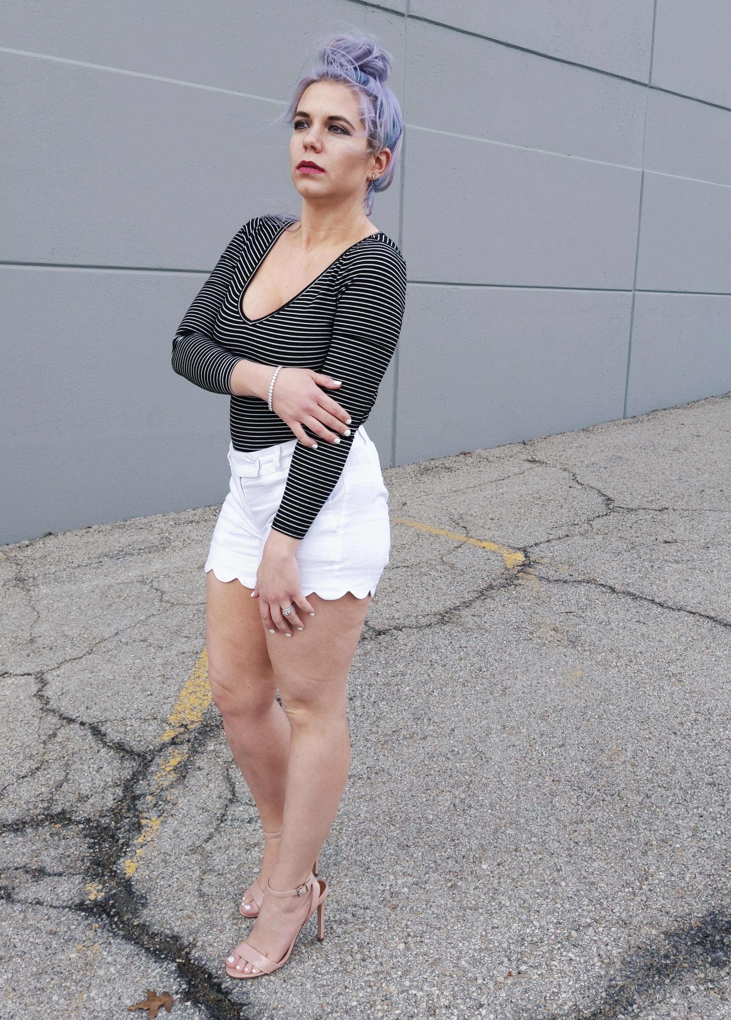 #sponsored This gorgeous tennis bracelet is the perfect finishing touch to this black and white spring outfit! The tennis bracelet is from @Kohls fine jewelry collection and matches everything! I love the sparkle it adds to this black bodysuit and white scalloped shorts outfit for spring fashion 2019. #KohlsJewelry #KohlsFinds #WomensFashion #SpringStyle 