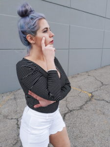 Purple Hair Messy Bun 3 #sponsored This gorgeous tennis bracelet is the perfect finishing touch to this black and white spring outfit! The tennis bracelet is from @Kohls fine jewelry collection and matches everything! I love the sparkle it adds to this black bodysuit and white scalloped shorts outfit for spring fashion 2019. #KohlsJewelry #KohlsFinds #WomensFashion #SpringStyle