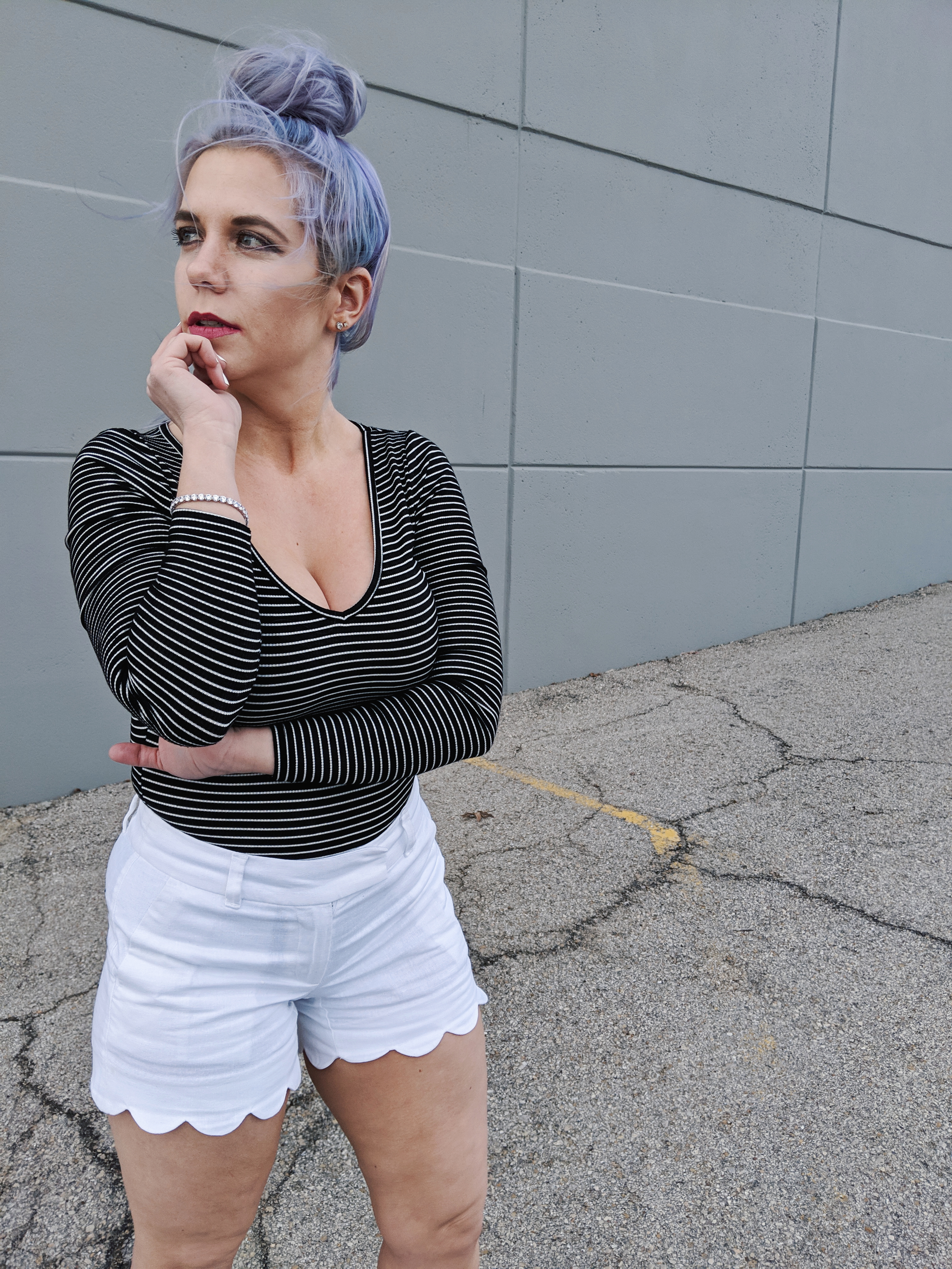 #sponsored This gorgeous tennis bracelet is the perfect finishing touch to this black and white spring outfit! The tennis bracelet is from @Kohls fine jewelry collection and matches everything! I love the sparkle it adds to this black bodysuit and white scalloped shorts outfit for spring fashion 2019. #KohlsJewelry #KohlsFinds #WomensFashion #SpringStyle 