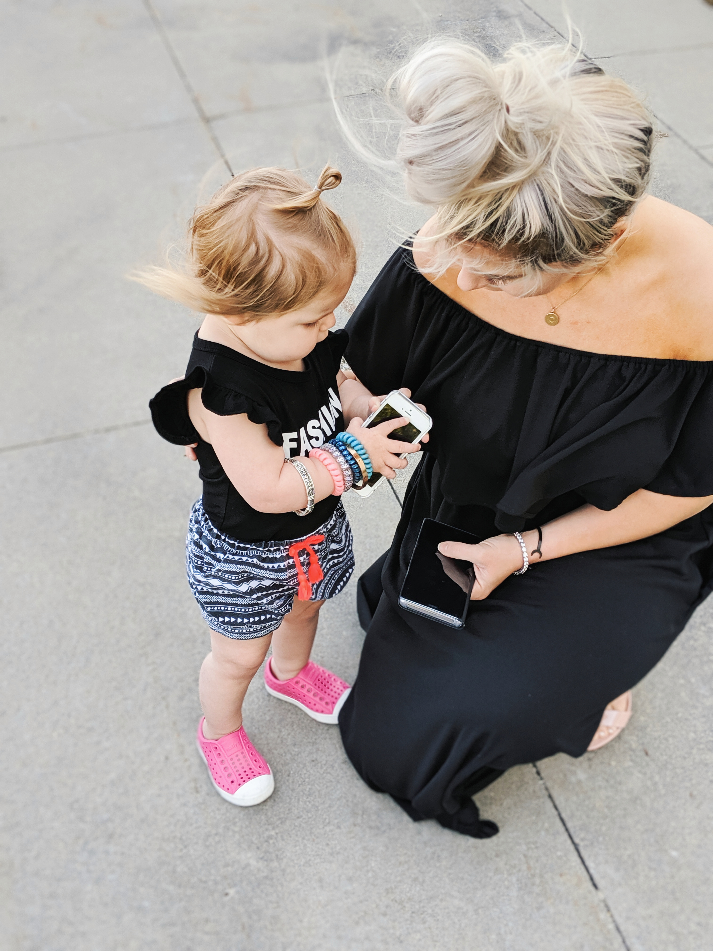 Mom and Toddler Girl with Phones