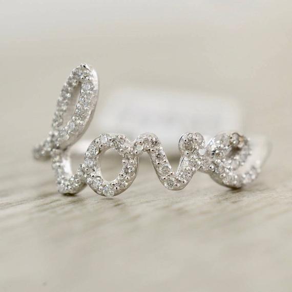 The Best Diamond Love Ring Dupes - Rounding up the best diamond love ring dupes! Love the Avanessi diamond love ring? I've found some great affordable love rings for you to choose from! #love #lovering #designerdupes #dupe 