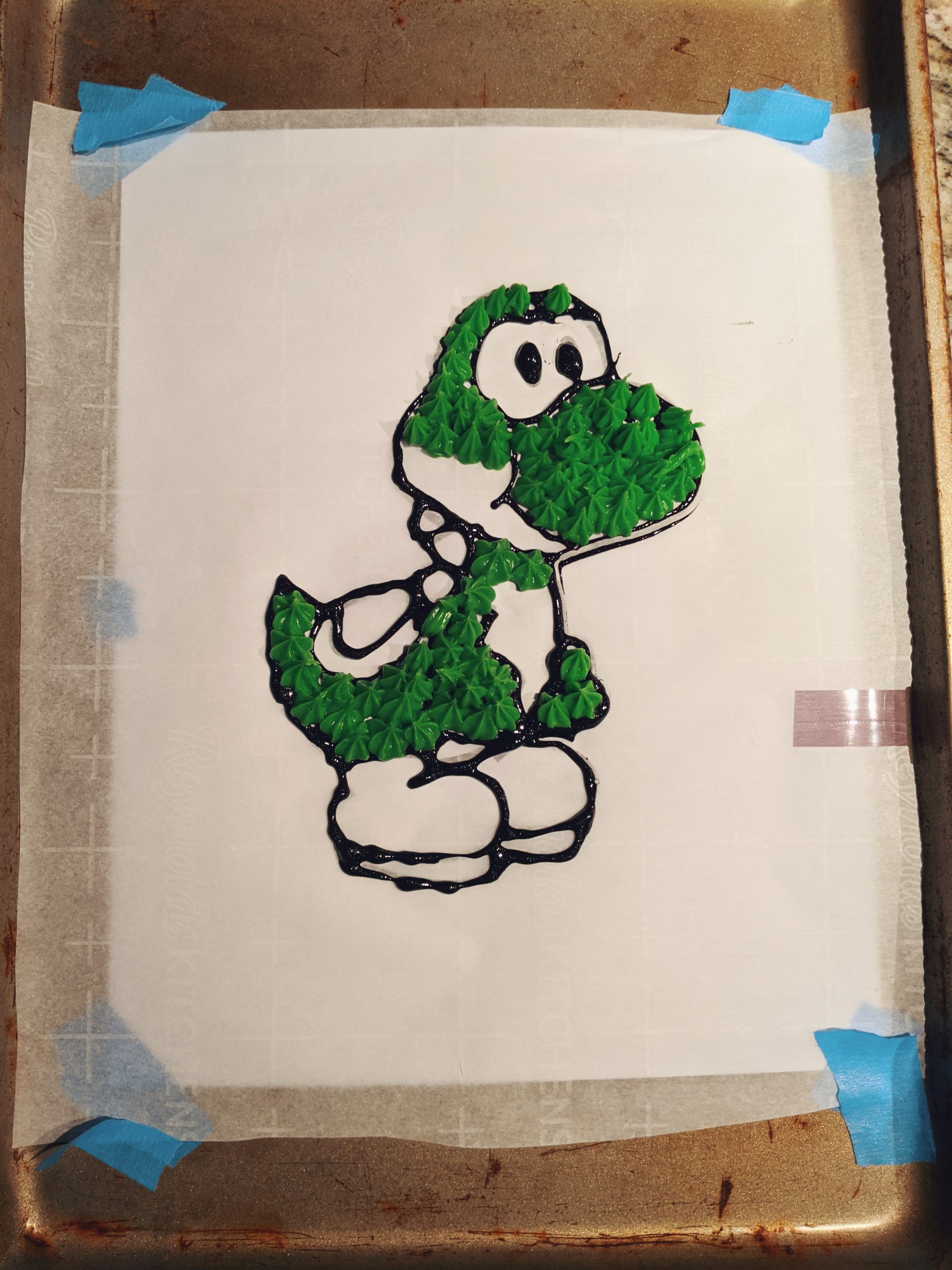 How to Make a Character Cake - DIY Character Cake: Easy DIY Instructions to put ANY character on a cake! Here's how to do a frozen buttercream transfer to make a character cake. #cakedecorating #yoshi #cakes 