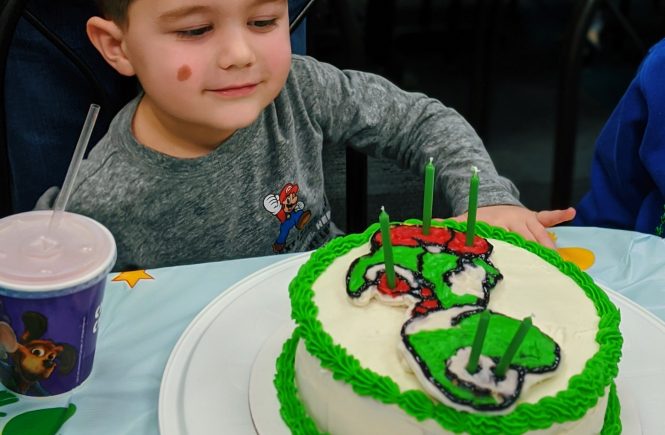 How to Make a Character Cake - DIY Character Cake: Easy DIY Instructions to put ANY character on a cake! Here's how to do a frozen buttercream transfer to make a character cake. #cakedecorating #yoshi #cakes
