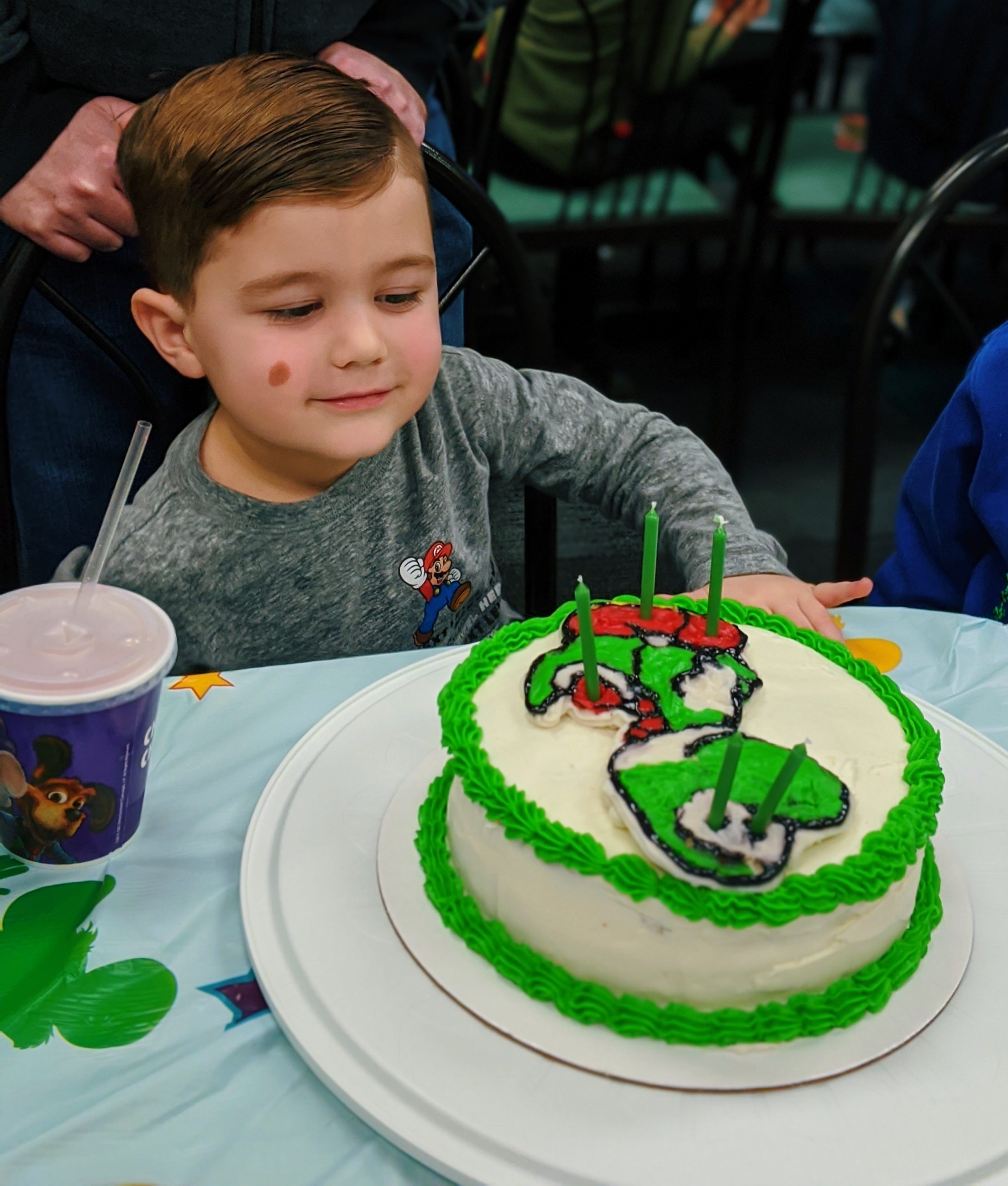 How to Make a Character Cake - DIY Character Cake: Easy DIY Instructions to put ANY character on a cake! Here's how to do a frozen buttercream transfer to make a character cake. #cakedecorating #yoshi #cakes 