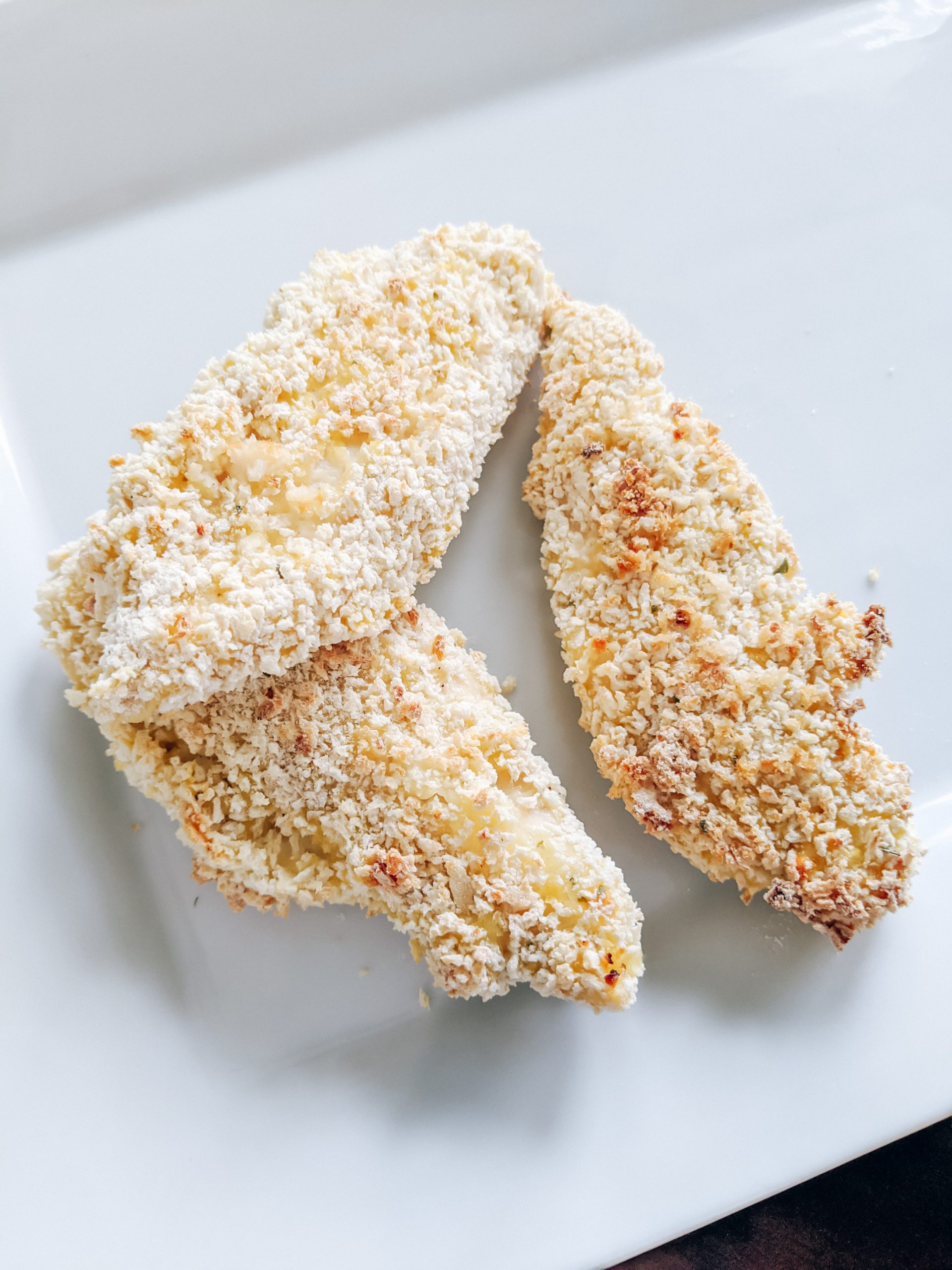 Baked Chicken Tenders with Crispy Panko Breading - This easy chicken tenders recipe with panko breading is a family favorite! The kids can even help prepare these! The panko breading makes them nice and crispy straight out of the oven, no need for frying. #chickenrecipes #chickentenders #kidfriendlyfoods