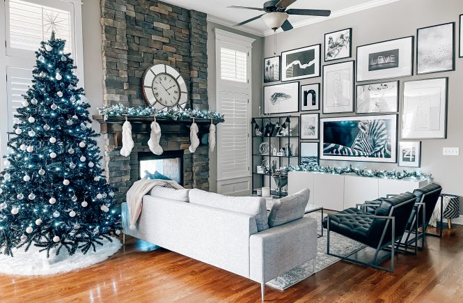 Modern Living Room Christmas Decor - Blogger Tricia Nibarger shares living room Christmas decor in her modern home, featuring a black Christmas tree and a monochrome Christmas theme! #modern #christmasdecor #blackchristmastree