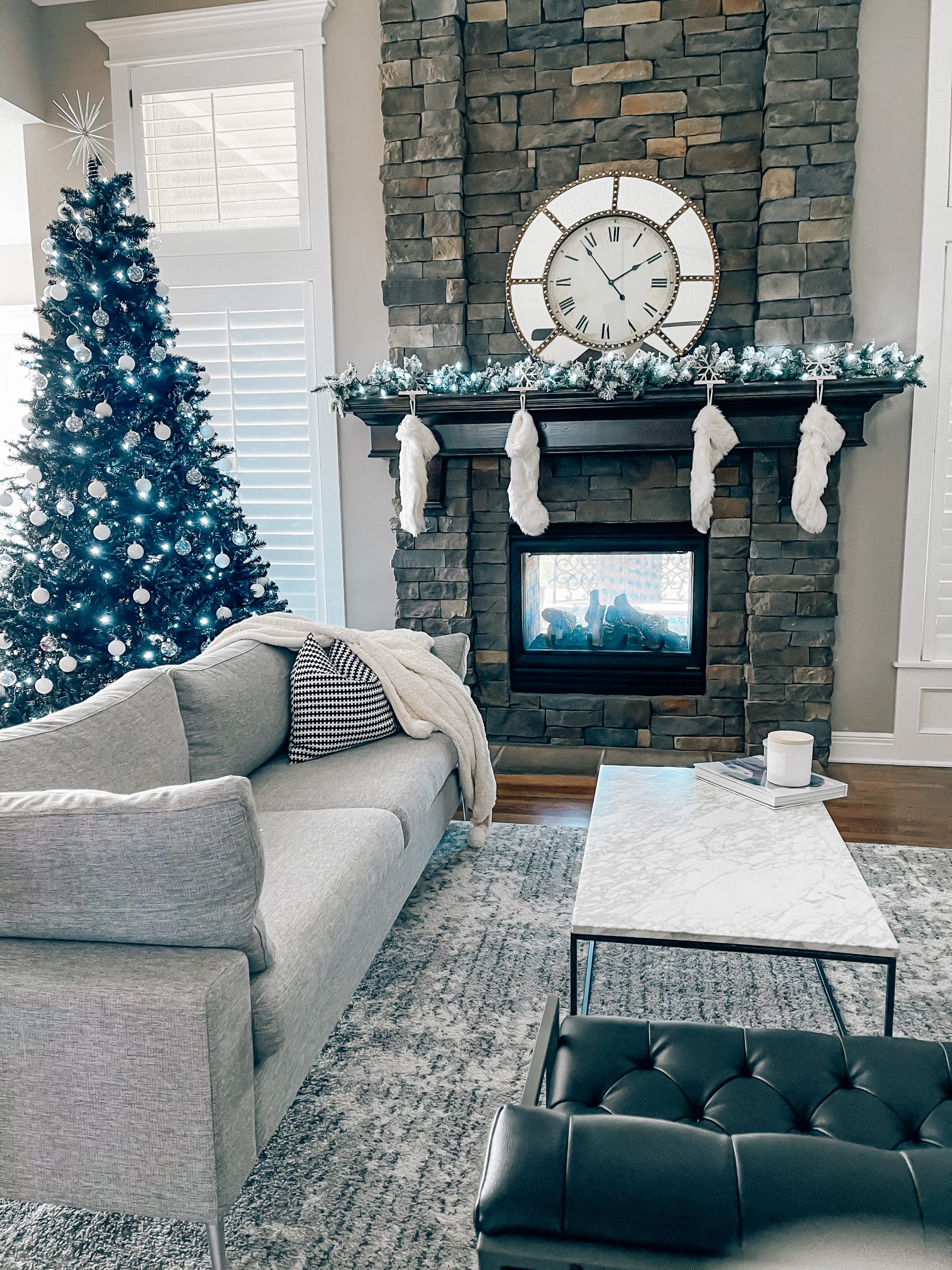 Modern Living Room Christmas Decor - Blogger Tricia Nibarger shares living room Christmas decor in her modern home, featuring a black Christmas tree and a monochrome Christmas theme! #modern #christmasdecor #blackchristmastree 