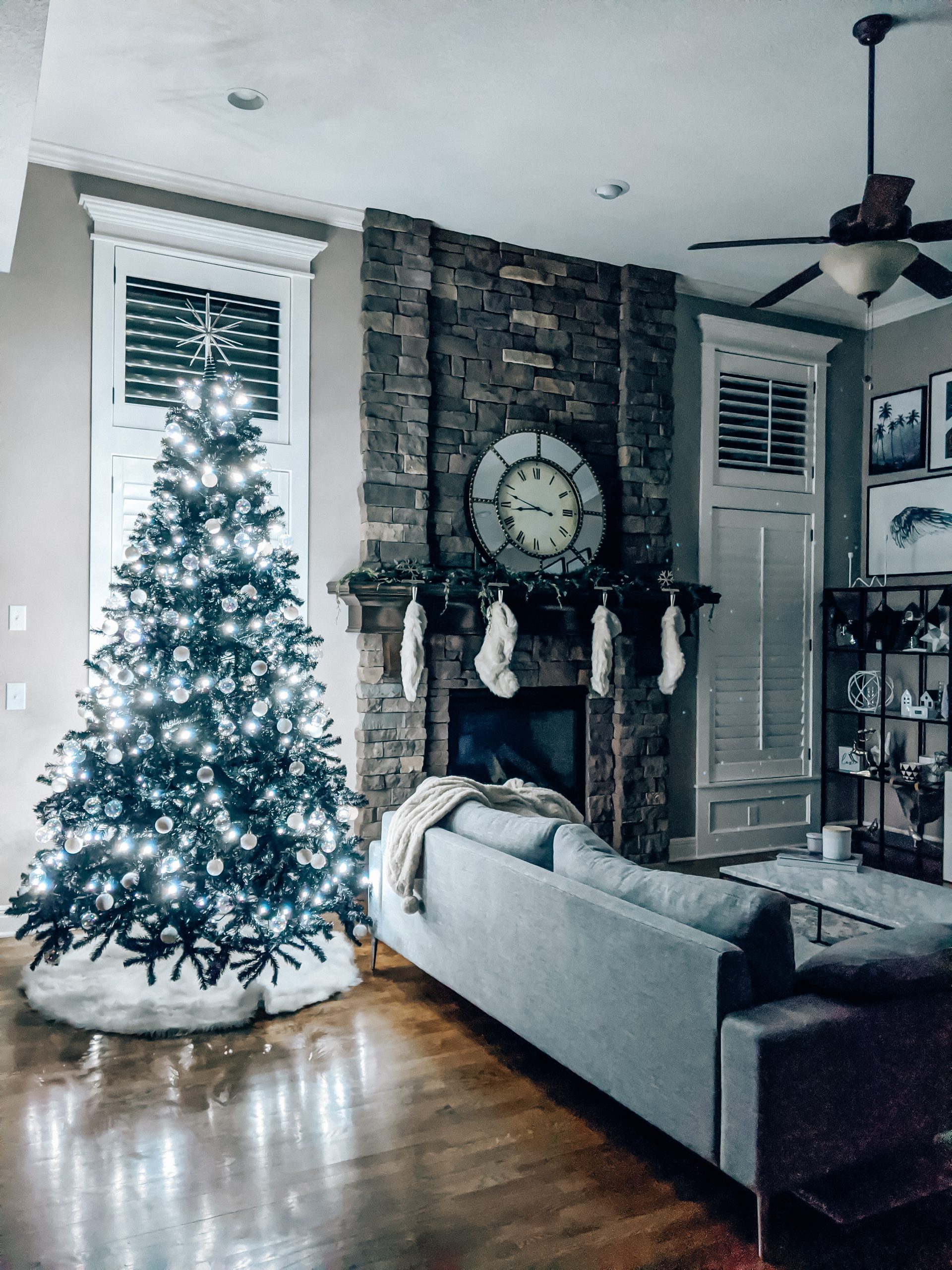 Modern Living Room Christmas Decor - Blogger Tricia Nibarger shares living room Christmas decor in her modern home, featuring a black Christmas tree and a monochrome Christmas theme! #modern #christmasdecor #blackchristmastree 