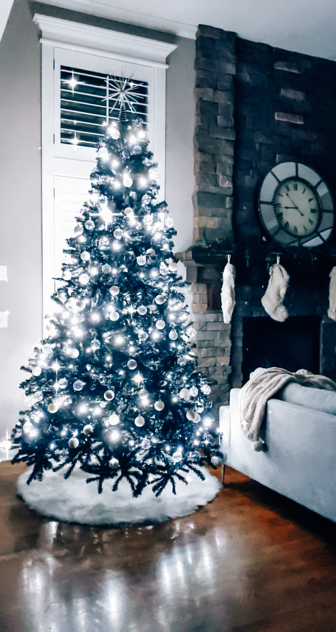 Modern Living Room Christmas Decor - Blogger Tricia Nibarger shares living room Christmas decor in her modern home, featuring a black Christmas tree and a monochrome Christmas theme! #modern #christmasdecor #blackchristmastree 